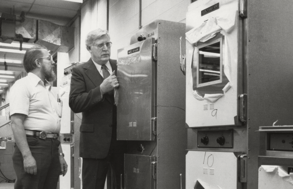 Jerry Maahs inspecting Cook & Hold oven 1970s